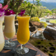 Frozen drinks over scenic Hawaiian landscape
